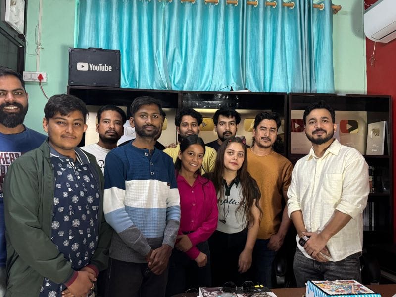 The Monal Digital team inside the studio, beside their YouTube creator awards